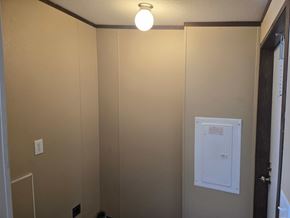 Shawnee house for rent - A small white box is on the wall.