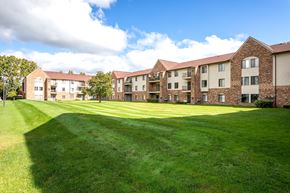 Southfield apartment for rent - the outlook of an apartment complex with a green lawn