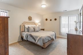 Southfield apartment for rent - a bedroom with a bed and a window