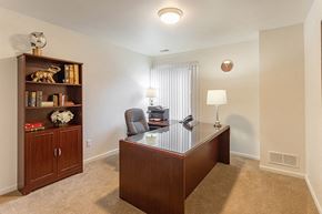 Southfield apartment for rent - an empty office with a desk and a bookcase