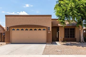 Avondale house for rent - A tan house with a brown garage door.