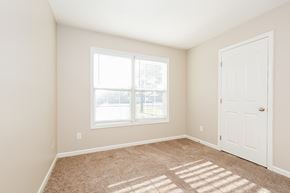 Smyrna house for rent - an empty bedroom with a door and a window