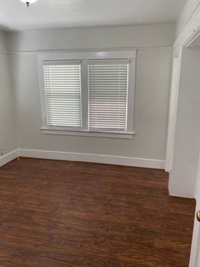 Long Beach apartment for rent - an empty room with wood floors and a window