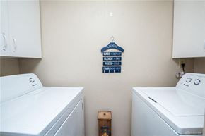 Union house for rent - A laundry room with a sign that says "Wash Repeat" and two washing machines.