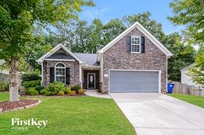 Winston Salem house for rent - A house with a garage and a driveway in front of it.