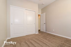 Buckeye house for rent - a bedroom with two closets and a carpeted floor