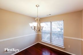 Bessemer house for rent - a dining room with a large window and a chandelier