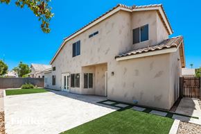 Mesa house for rent - A house with a white exterior and a brown roof.