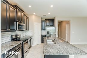 Ruskin house for rent - A kitchen with granite countertops and stainless steel appliances.