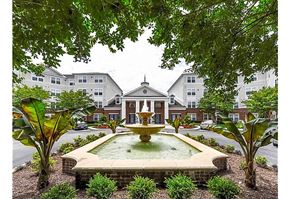 Capitol Heights apartment for rent - a fountain in the middle of a courtyard in front of a building