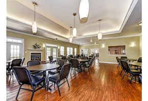 Capitol Heights apartment for rent - a large dining room with tables and chairs and a fireplace