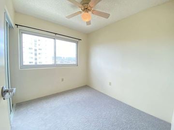 Waipahu apartment for rent - a bedroom with a ceiling fan and a window