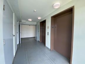 Waipahu apartment for rent - a long hallway with doors and white walls