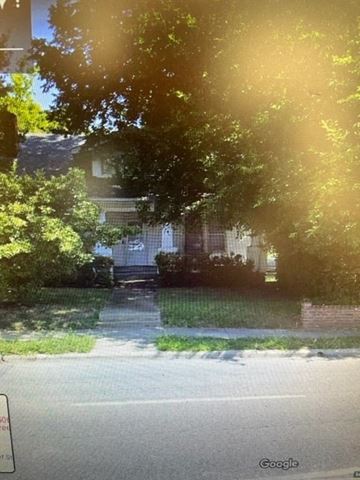 Greensboro apartment for rent - a house on a street with trees in front of it