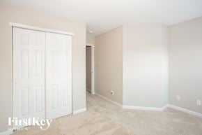 Concord house for rent - a bedroom with two closets and a carpeted floor