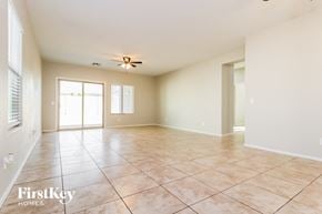 Buckeye house for rent - A spacious room with tile flooring and a ceiling fan.