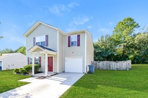Winston Salem house for rent - a white house with a yard and a driveway