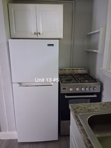 Trenton apartment for rent - A white fridge and stove in a kitchen.