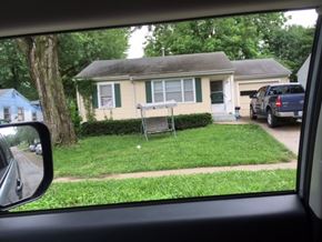 Windsor house for rent - A house with a blue car parked in front.
