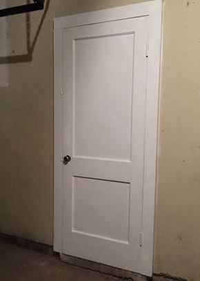 Windsor house for rent - A white door with a handle is closed.