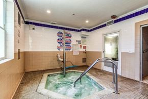 Sherman Oaks apartment for rent - a jacuzzi tub in a bathroom with a glass door