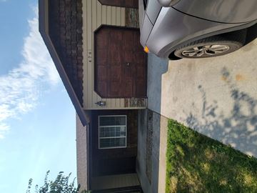 Hayden house for rent - the front of a house with a car parked in front of it