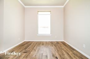 Edmond house for rent - A room with wooden flooring and a window.