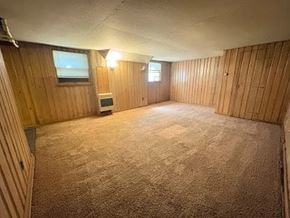Fremont apartment for rent - A room with wooden walls and carpeted floor.
