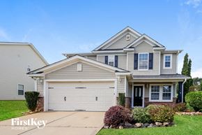 Gastonia house for rent - a suburban house with a white garage door