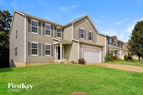 Wentzville house for rent - A house with a garage and a driveway is for sale.