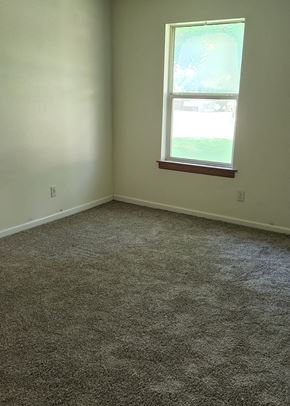 Clinton apartment for rent - A room with a carpeted floor and a window.