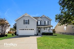 Clarksville house for rent - a white house with a white garage door