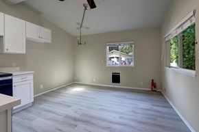 Issaquah apartment for rent - an empty living room with a window and a kitchen
