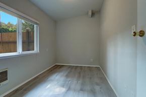 Issaquah apartment for rent - an empty room with wooden floors and a large window