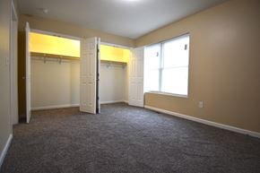 Terre Haute triplex for rent - an empty bedroom with a closet and a window