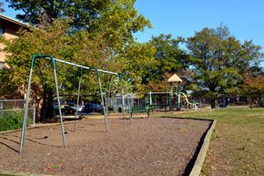 Springfield apartment for rent - a playground with a swing set in a park