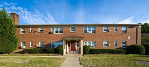 Springfield apartment for rent - the front of a brick building with a sidewalk in front