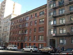 San Francisco apartment for rent - a brick building on a city street with cars