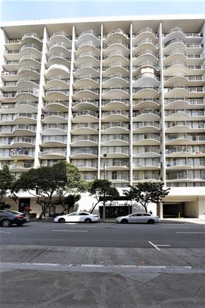 San Francisco apartment for rent - a city street with cars parked in front of an apartment building