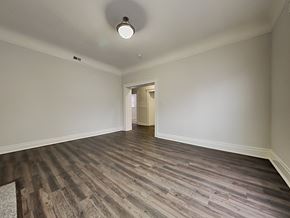 San Francisco apartment for rent - an empty living room with wood flooring and white walls