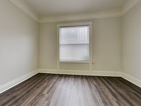 San Francisco apartment for rent - an empty room with wooden floors and a window