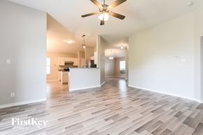 Lancaster house for rent - a living room with a kitchen and a ceiling fan