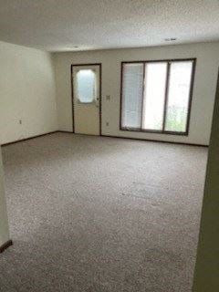 Clinton apartment for rent - an empty living room with a window and a door