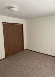 Clinton apartment for rent - an empty room with a wooden door in it