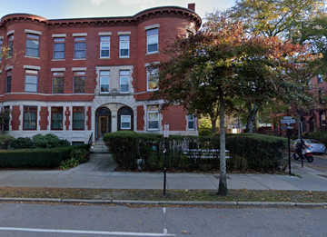 Brookline apartment for rent - a red brick building with a tree in front of it