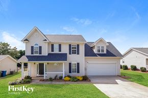 Mount Holly house for rent - a white house with a blue roof and white garage doors