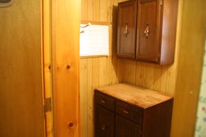 Westville apartment for rent - a small bathroom with wooden cabinets and a window