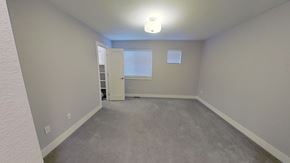 Denver house for rent - a bedroom with a carpeted floor and a door to a closet