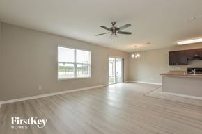 Port Orange house for rent - A spacious room with a ceiling fan and a countertop.