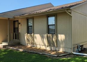 Clinton apartment for rent - the front of a house with a porch and grass